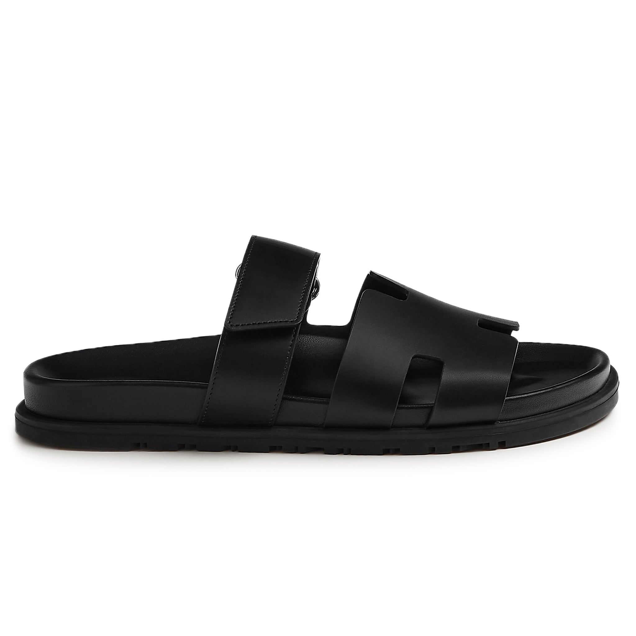 Side view of Hermes Paris Chypre Leather Sandal Black H211865ZH01390